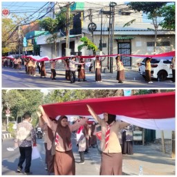 Spektakuler! Ribuan Siswa SMKN 8 Surabaya Kibarkan Bendera Merah Putih Raksasa